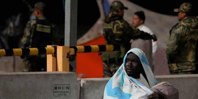 A migrant holds a child