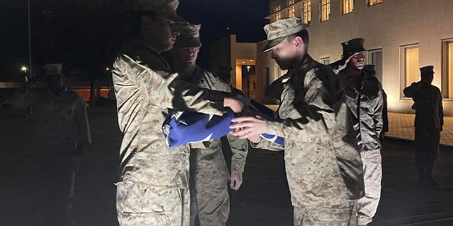 US Marines fold flag at US Embassy in Khartoum, Sudan