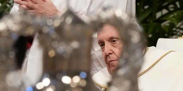 Pope Francis blesses chrism oil during a Mass inside St. Peters Basilica, at the Vatican on Holy Thursday, April 6, 2023.