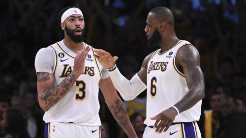LeBron James celebrates with Anthony Davis after a three-point basket in the second half against the Utah Jazz.