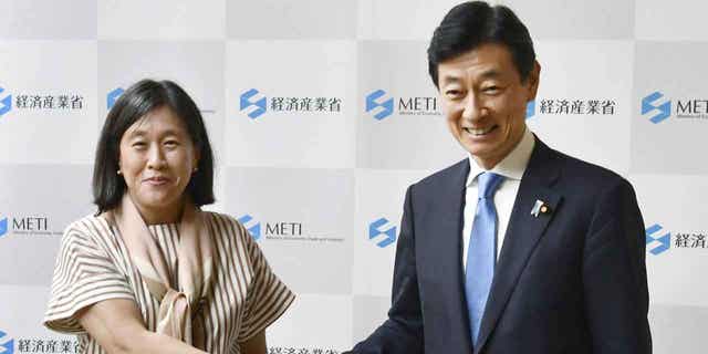 U.S. Trade Representative Katherine Tai, left, shakes hands with Japan’s Economy Minister Yasutoshi Nishimura before their talk in Tokyo, Japan, on April 19, 2023.