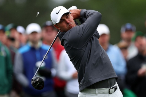 Brooks Koepka plays his shot from the eighth tee during the continuation of the weather-delayed third round on Sunday.