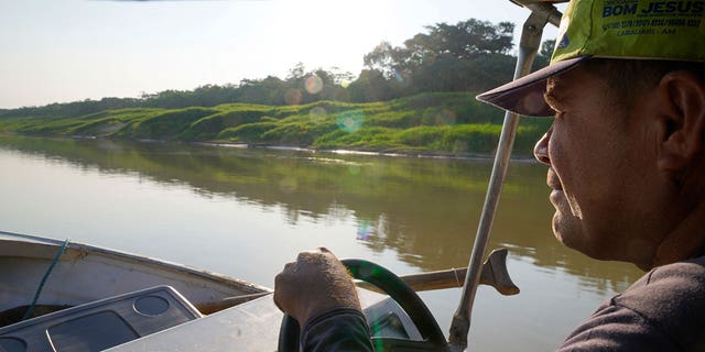Man maneuvers boat in Brazil