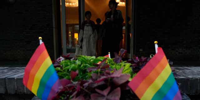 Attendees arrive for the opening ceremony for Diversity Week