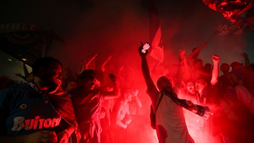 Napoli fans celebrate the team's Serie A title victory on the streets of Naples. 