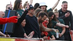 Soccer Football - National League - Wrexham Victory Parade - Wrexham, Wales, Britain - May 2, 2023 Wrexham co-owners Rob McElhenney and Ryan Reynolds celebrate on the bus with a beer during the victory parade REUTERS/Carl Recine