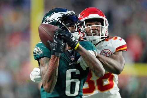 Eagles wide receiver DeVonta Smith tries to bring in a pass late in the first half. The officials reviewed the play and ruled that it was not a catch.