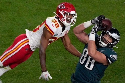 Eagles tight end Dallas Goedert pulls in a pass late in the first half. Philadelphia led 24-14 at halftime.