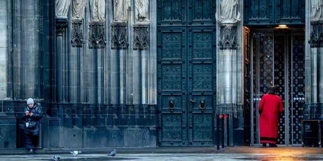 A cathedral door keeper is shown