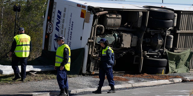 Police inspecting the bus