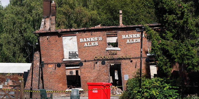 Crooked House pub remains