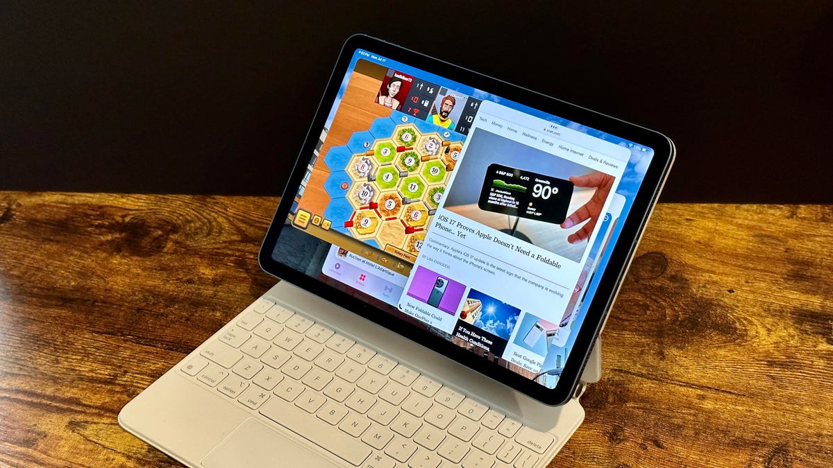 An iPad in keyboard case with multiple apps open