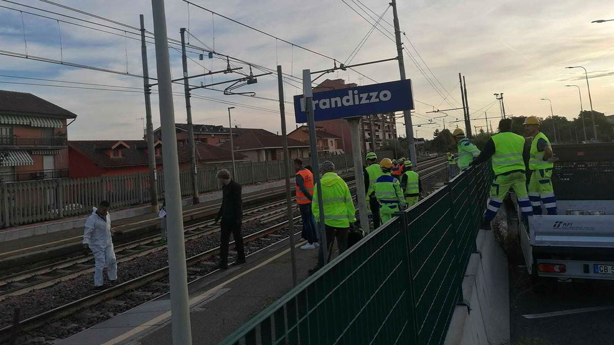 firefighters inspect traintracks