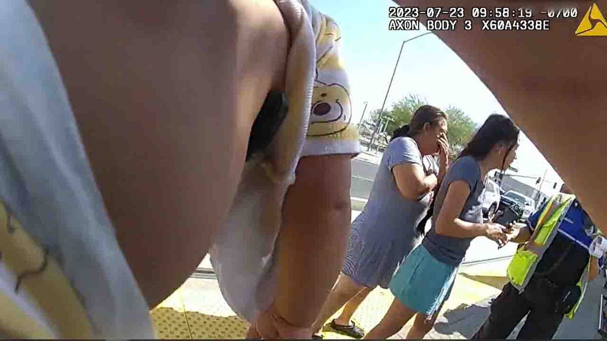 officer patting baby's back