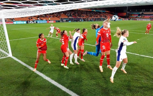 Switzerland players, in red, defend their box during a match against Norway on July 25. The match ended in a 0-0 draw.