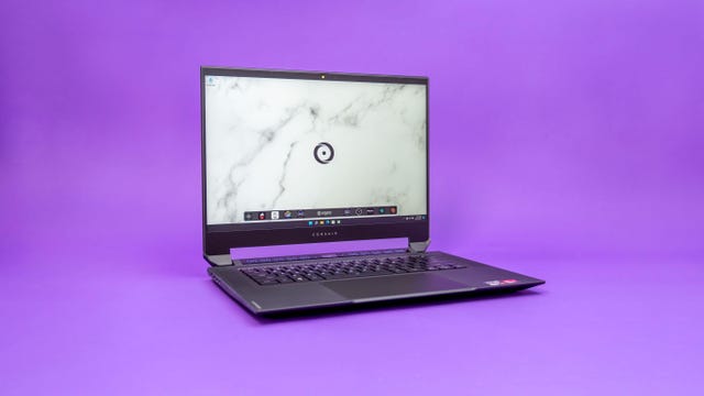 Corsair Voyager a1600 gaming laptop open on a purple background.