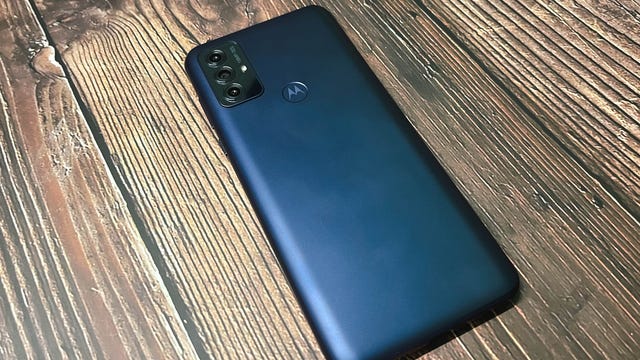 Moto G Play's back with three cameras and fingerprint sensor.