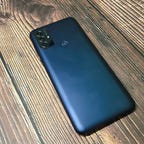 Moto G Play's back with three cameras and fingerprint sensor.
