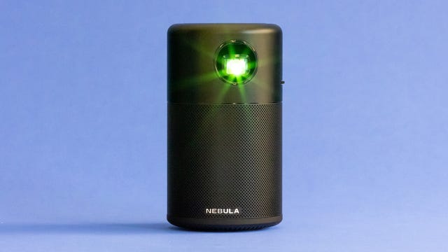 Anker Nebula Capsule projector shining a green light
