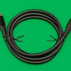 Monoprice's AtlasFlex USB-C charging and data cable, coiled on a green background