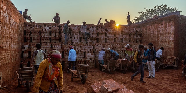 Nepalese workers at brick site