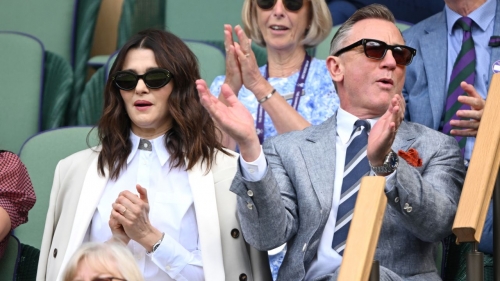 Rachel Weisz and Daniel Craig watch Carlos Alcaraz vs Novak Djokovic in the Wimbledon 2023 men's final on Centre Court during day fourteen of the Wimbledon Tennis Championships at the All England Lawn Tennis and Croquet Club on July 16, 2023 in London, England.