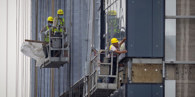 Men working on apartment building