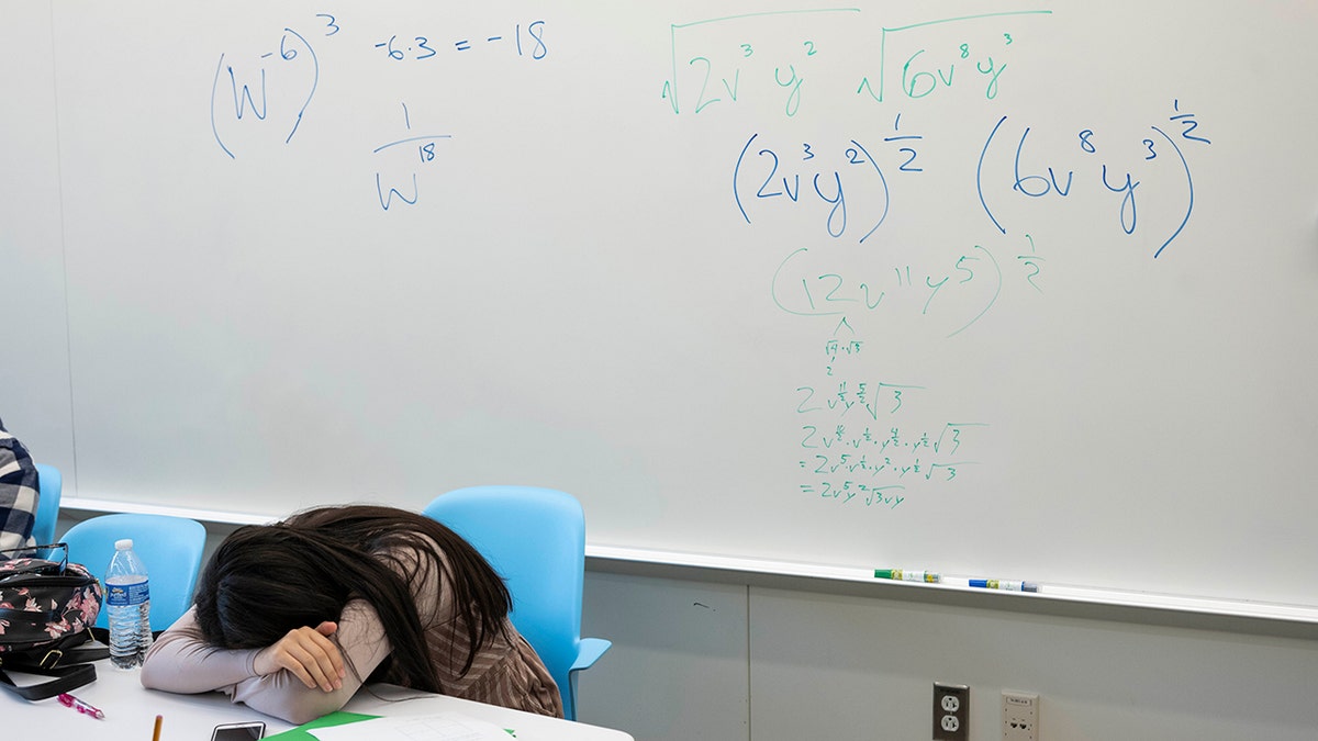 Student with head on desk