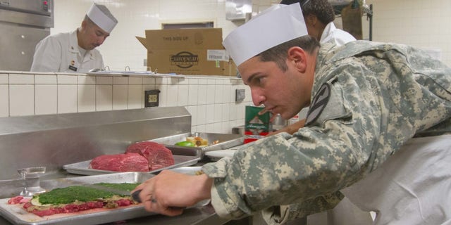 Cook in Army dining facility