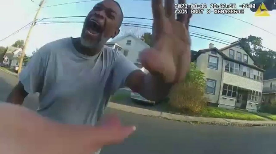 Man with hammer charges toward police officer