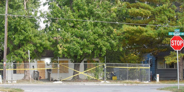 Timothy Haslett's small home boarded up and taped off