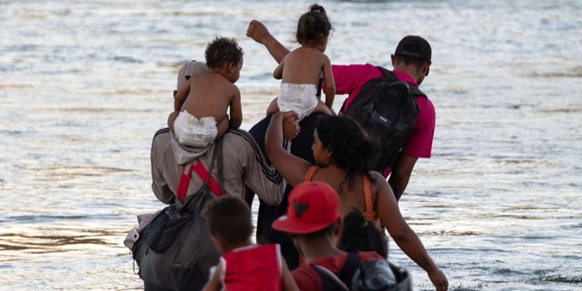 Migrants cross Rio Grande