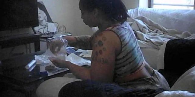 Suspect allegedly packing drugs