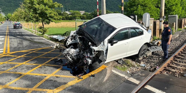 Car after crashing into train in Taiwan