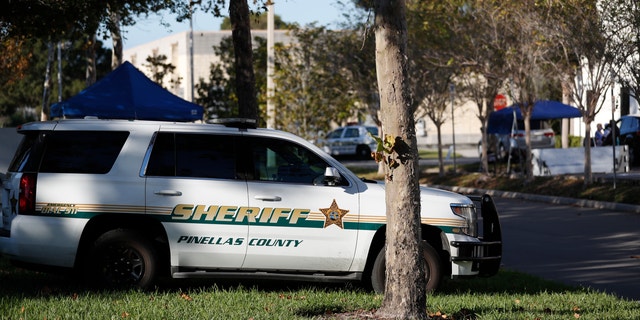 A Pinellas County Sheriff deputy parked along the road.