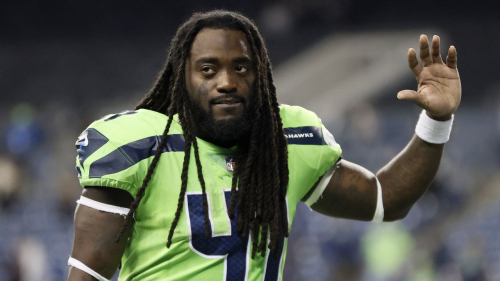 SEATTLE, WASHINGTON - OCTOBER 07: Alex Collins #41 of the Seattle Seahawks jogs off the field after losing 26-17 to the Los Angeles Rams at Lumen Field on October 07, 2021 in Seattle, Washington. (Photo by Steph Chambers/Getty Images)
