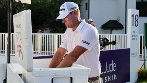 MEMPHIS, TENNESSEE - AUGUST 13: Lucas Glover of the United States cools off in the ice on the 18th tee during the final round of the FedEx St. Jude Championship at TPC Southwind on August 13, 2023 in Memphis, Tennessee. (Photo by Andy Lyons/Getty Images)