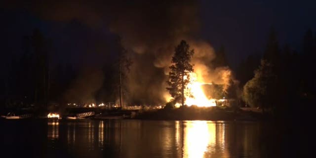 Gray Fire burning near lake
