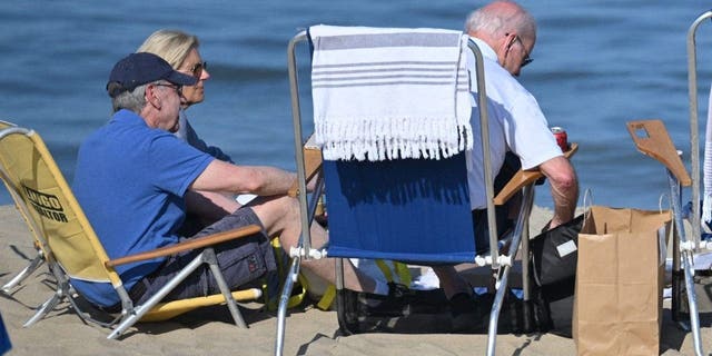 US First Lady Jill Biden (L) sits with US President Joe Biden (R)