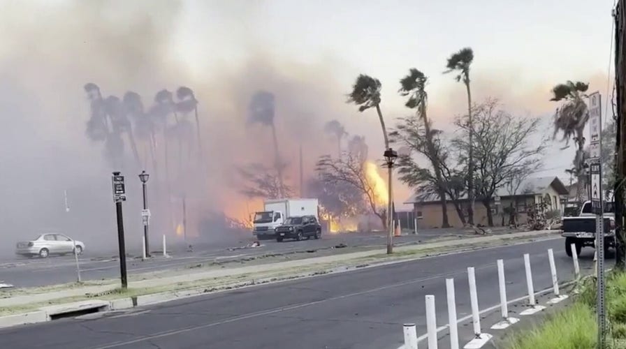 WATCH: Wildfire rages in Hawaii, person almost struck by debris