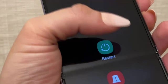 Woman holding her phone.