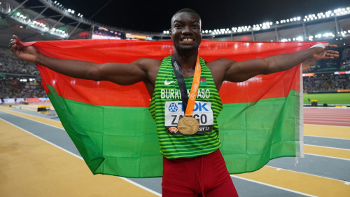 Athletics - World Athletics Championship - Men's Triple Jump Final - National Athletics Centre, Budapest, Hungary - August 21, 2023 Burkina Faso's Hugues Fabrice Zango celebrates winning gold REUTERS/Aleksandra Szmigiel