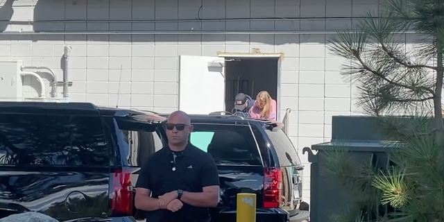 Hunter Biden is photographed ducking his head as he exits the building in Nevada on Wednesday.