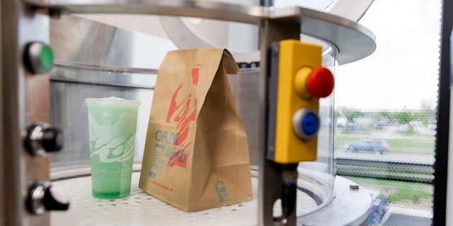 Photo of an AI-automated drive-thru delivery from Taco Bell.