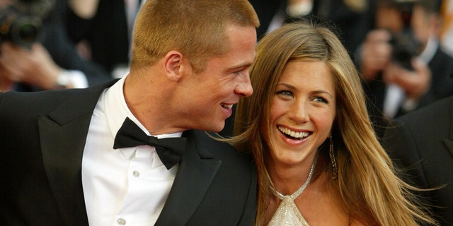 Brad Pitt and Jennifer Aniston attend a premiere