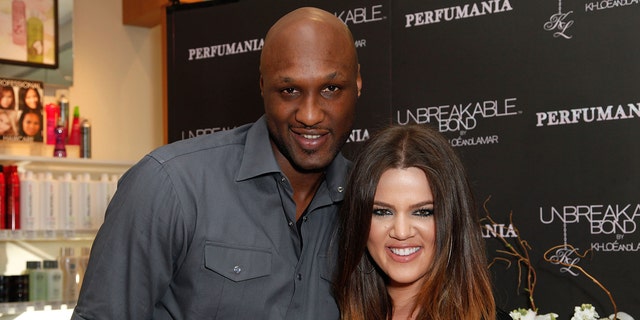 Lamar Odom and Khloé Kardashian pose for a photo