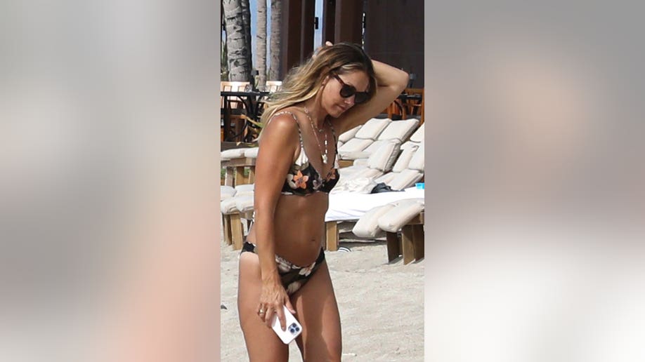 Christine Baumgartner wears sunglasses