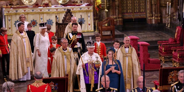 Britain's King Charles walks in the Coronation Procession after his coronation ceremony at Westminster Abbey