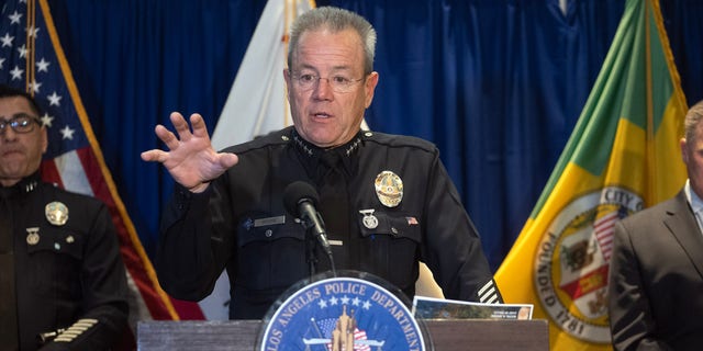 LAPD Chief Michel Moore speaking from lectern