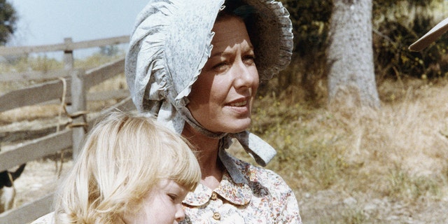 Karen Grassle holding onto either Brenda or Wendi in costume